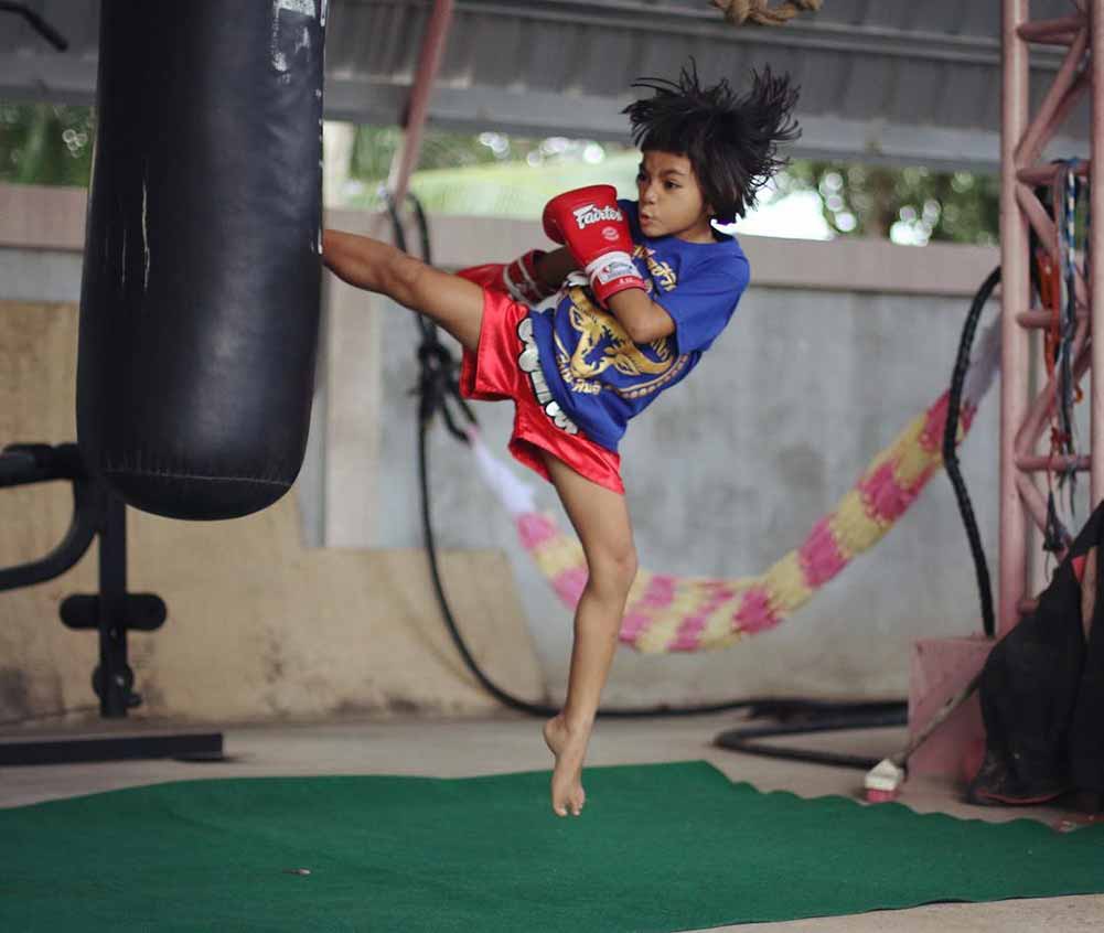 Young warrior practices Muay Thai