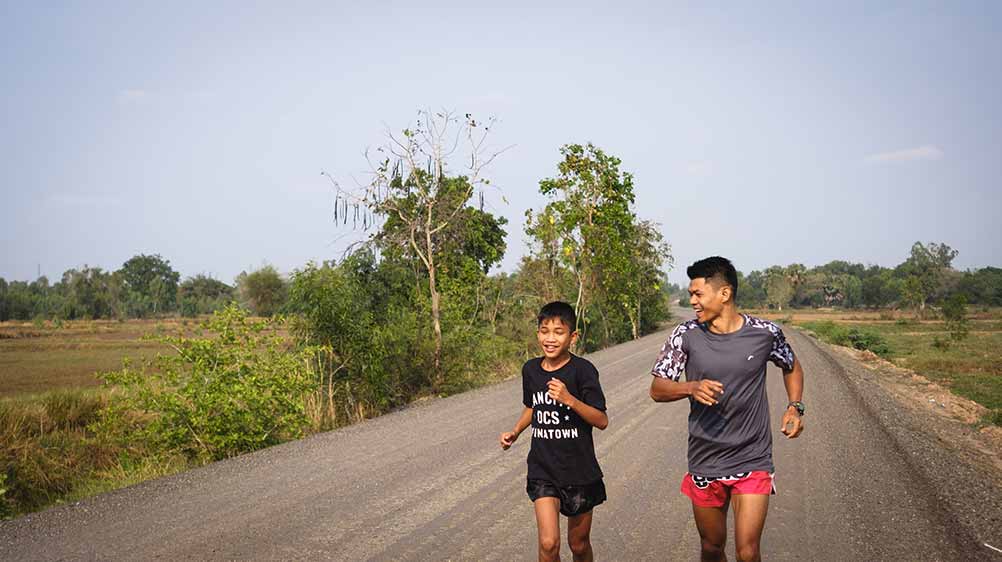 Boom running with one of the fighters